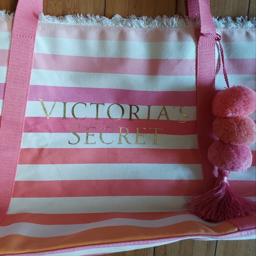Victoria secret pink striped tote bag with pink pompoms and tassel